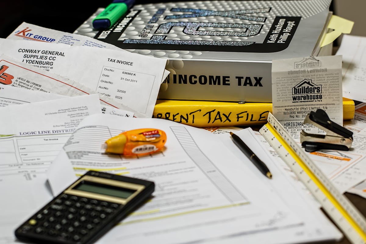 Calculator and financial documents for cleaning business tax tracking